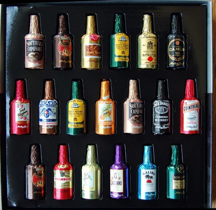 an assortment of liquor bottles in a black box