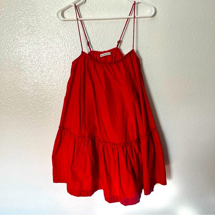 Abercrombie Summer Dress Includes Pockets Color: Bright Red Perfect For Summer Stretchy Double Lined 60% Cotton, 40% Polyester Never Been Used Red A-line Mini Dress For Summer, Red A-line Sundress For Summer, Red Spaghetti Strap Midi Dress For Brunch, Red Midi Dress With Spaghetti Straps For Brunch, Red Ruffle Hem Dress For Vacation, Red A-line Summer Mini Dress, Casual Red Mini Dress With Ruffle Hem, Red A-line Mini Dress For The Beach, Red A-line Mini Dress For Beach