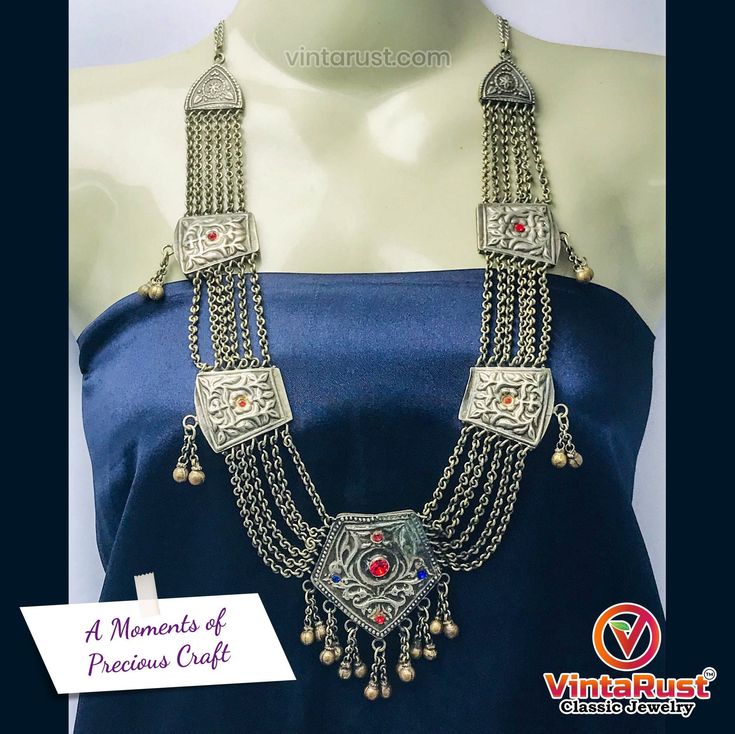 *This ethnic vintage tribal mala necklace with an antique pendant is one of the most intriguing jewelry pieces we have in our collection of tribal and vintage jewelery. This tribal mala necklace comprises oxidized chains, tassels with rhythmic silver bells and glass stones of different colors. *This necklace takes back to ancient times. The grace this Kuchi tribal vintage necklace contains, shows tribal courage and strength. This heirloom tribal necklace is comprised of vintage pieces from the n Bohemian Brass Jewelry For Vintage Collection, Antique Metal Necklaces For Festivals, Bohemian Necklace With Vintage Charm, Vintage Metal Jewelry With Intricate Design, Handmade Bohemian Long Temple Necklace, Handmade Temple Jewelry Necklaces For Festivals, Traditional Antique Silver Jewelry For Vintage Collection, Bohemian Antique Silver Jewelry With Vintage Charm, Bohemian Temple Necklace As A Gift