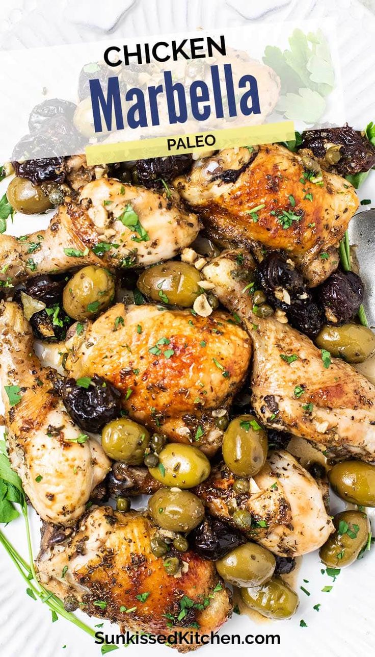 chicken marbella with olives and parsley on a white plate