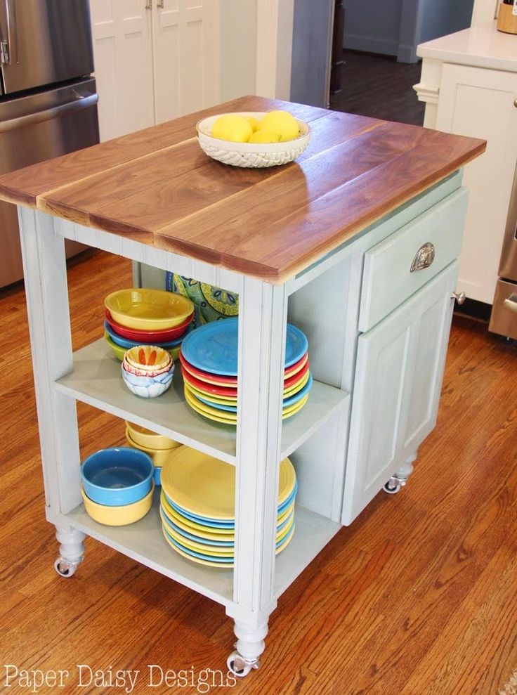 a kitchen island with plates and bowls on it