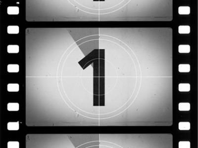 an image of a film strip with the number one on it and arrows pointing in different directions