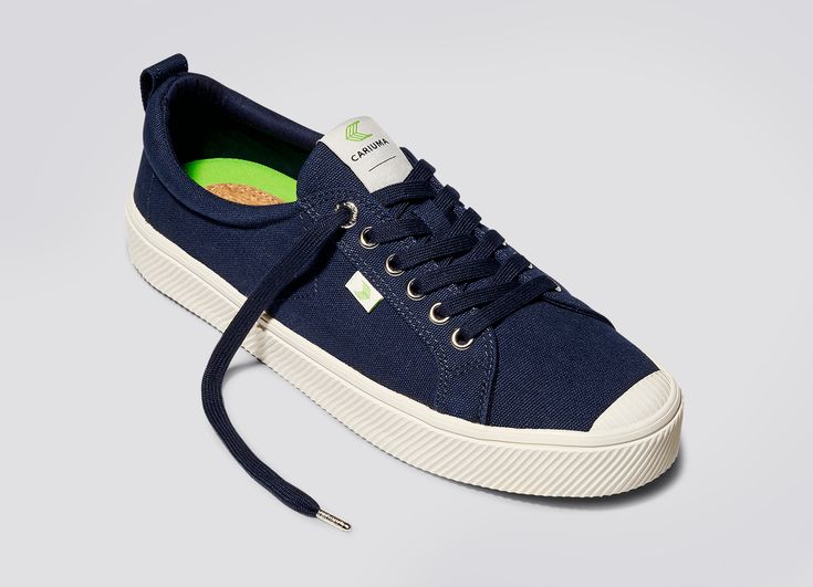 Sleek, refined yet understated. The OCA Low Navy is our take on the classic navy sneaker, with the laid-back spirit of Rio embedded into every stitch. Handcrafted using a robust canvas, the OCA Low Canvas exists at the intersection of functionality and style. With our 100% vegan insoles made from organic mamona oil and cork , it ensures optimal comfort and fit. The OCA Low boast a unique cap toe design and a fully-stitched lightweight outsole for a durable, long-lasting shoe. Finishing our OCA L Canvas Sneakers Men, Canvas Sneakers Womens, Navy Sneakers, Vegan Sneakers, Spring Sneakers, Vintage Suede, Knit Sneakers, Sneaker Men, Elegant Shoes