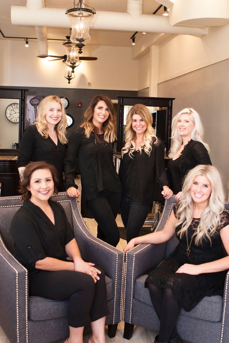 a group of women sitting around each other in chairs