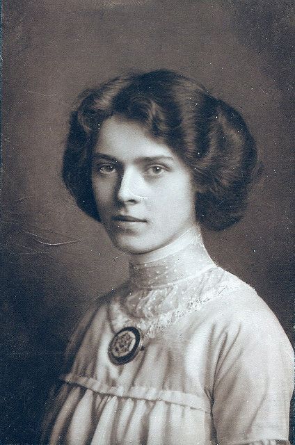 an old black and white photo of a woman