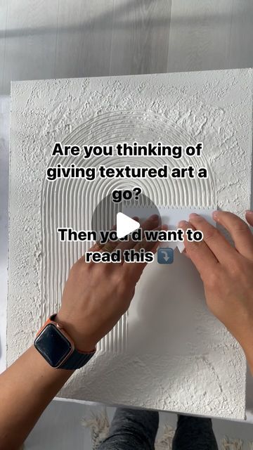 two hands are working on an art piece with text that reads, are you thinking of giving textured art a go? then you'd want to read this