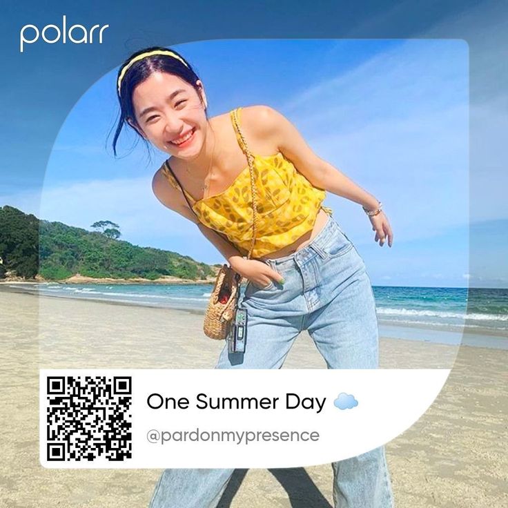 a woman standing on top of a beach next to the ocean with qr code