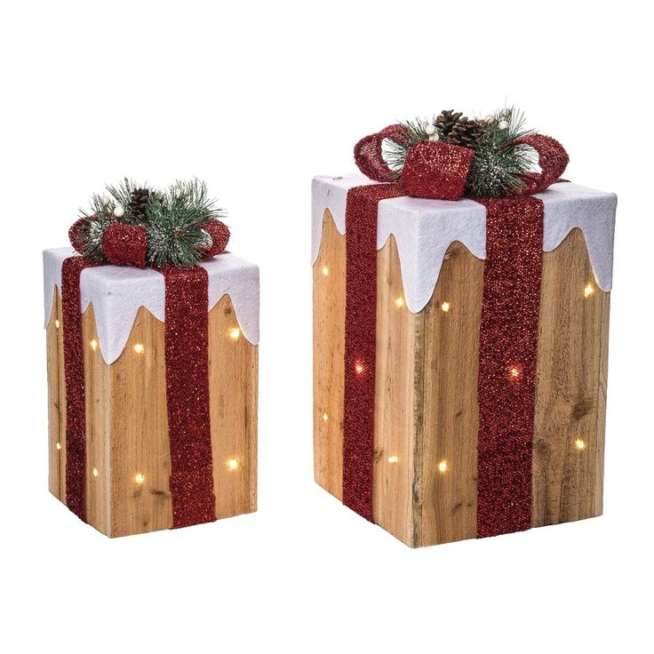 two wooden boxes decorated with lights and bows