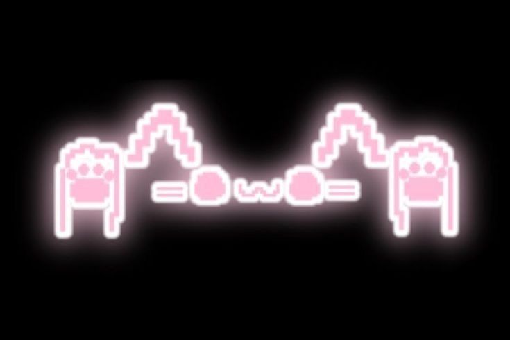 the neon text glows pink against a black background