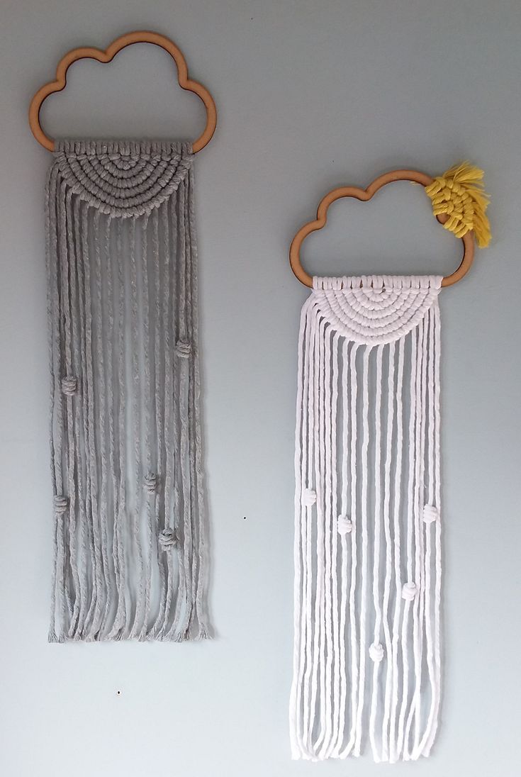 two wall hangings made out of string and wood