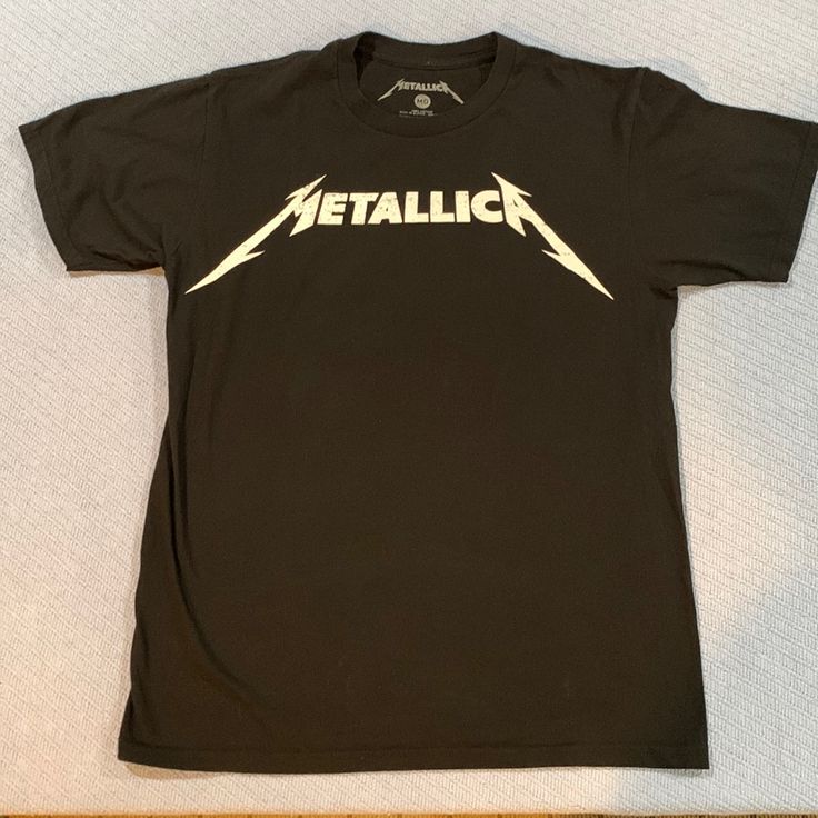 This Metallica T-Shirt Is 100% Cotton. It Is New Without Tags. Has A Vintage Weathered Look. See Photo. Band Merch Cotton Tops With Logo Print, Black Band Logo Shirt For Summer, Black Shirt With Band Logo For Summer, Black Summer Shirt With Band Logo, Band Merch Crew Neck T-shirt With Logo, Band Merch Tops With Logo Print, Casual Cotton Shirt With Band Logo, Band Logo Graphic Tee With Crew Neck, Graphic Tee With Band Logo And Crew Neck