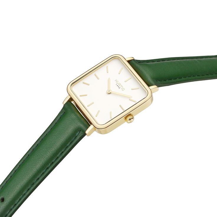 Modern Chic with a Conscience: The Hurtig Lane Neliö women's vegan leather square watch in Gold, White & Earth Green, perfectly balances contemporary style with ethical principles. Its striking square design and minimalist dial make this timepiece an instant classic, while the cruelty-free vegan leather strap showcases your commitment to sustainable fashion. The Neliö watch is more than just a stylish accessory - it's a symbol of your dedication to making a positive impact on the world. Powered Minimalist Rectangular Everyday Watches, Minimalist Everyday Rectangular Watches, Everyday Minimalist Watch With Rectangular Dial, Minimalist Everyday Watch With Rectangular Dial, Minimalist Rectangular Dial Watch For Everyday, Minimalist Rectangular Dial Watches For Everyday, Modern Everyday Rectangular Watch, Modern Rectangular Watches For Everyday Use, Timeless Rectangular Watch For Everyday Use