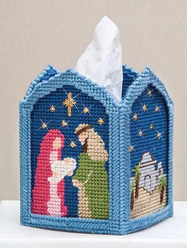 a tissue dispenser with a nativity scene on the front and side