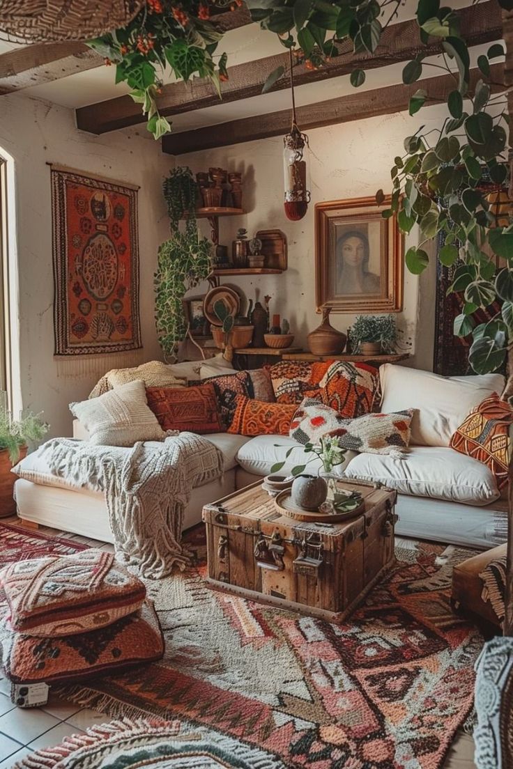 a living room filled with lots of furniture and plants on top of the couches