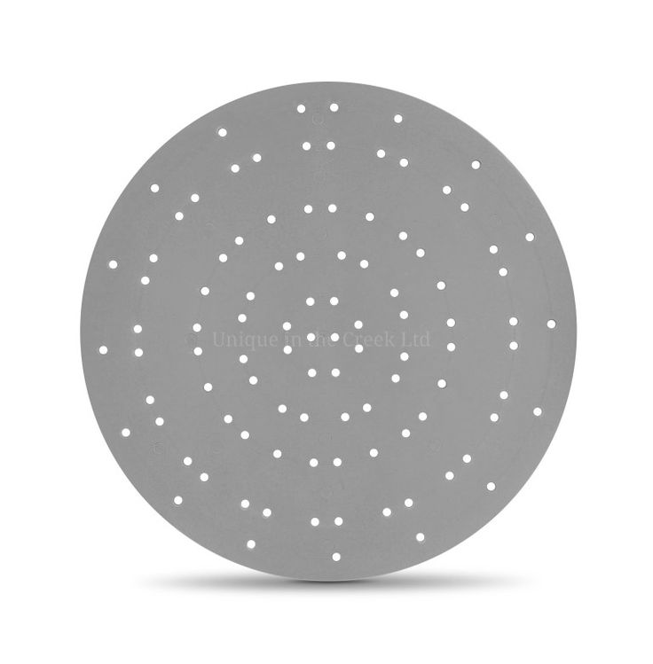 a round metal object with white dots on it