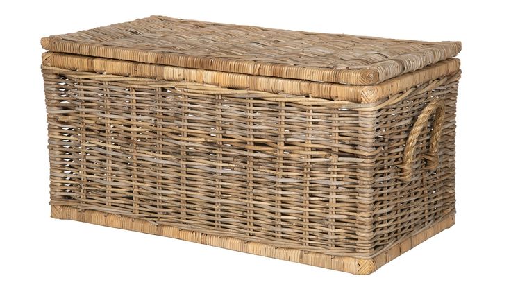 a large wicker basket with lid and handles on an isolated white background for use as a storage container