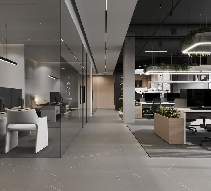 an empty office with glass walls and desks