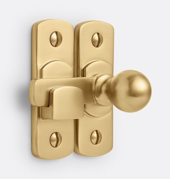 a golden door handle on a white background