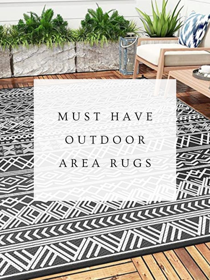 a black and white rug with the words must have outdoor area rugs on it