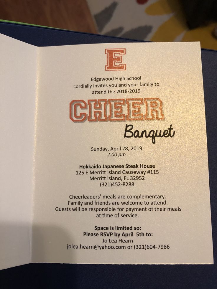 an open brochure with the words cheer banquet written in orange and gold on it