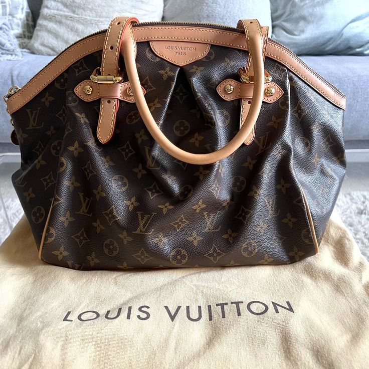 Selling An Authentic Louis Vuitton Tivoli Gm Bag. This Item Was Purchased At The Lv Store In Nyc. It's In Beautiful Condition. The Bag Is Spacious And Lightweight. Comes With A Larger Lv Dustbag (As The Original One Was Smaller And Meant To Store The Bag Flat). Dimensions 17"Lx10"Hx7w." Straps Are Adjustable. Comes From A Smoke And Pet Free Home. Free Poshmark Authentication. Lv Store, Louis Vuitton Tivoli, Vuitton Bag, Louis Vuitton Bags, Authentic Louis Vuitton, Louis Vuitton Bag, Dust Bag, Bag Lady, Louis Vuitton