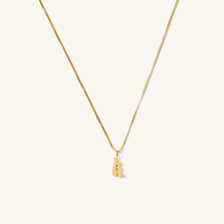 Whether you wear your loved one’s initial or your own, this dainty initial necklace is a chic way to personalize your neck stack. The Old English initial hangs on a box chain that reflects all the light. A thoughtful piece for you or any person in your life. 14k Gold Fill Letter: 1/2” x 1/4” Length: 16" + 2" Ext. Make your jewelry last! Click here for jewelry care. Need a gift box? We got you. Initial Pendant Charm Necklace Gift With Box Chain, Initial Pendant Necklace With Box Chain As Gift, Initial Pendant Necklace On Box Chain For Gifts, Gift Initial Pendant Charm Necklace With Box Chain, Gift Initial Pendant Necklace With Box Chain, Gift Initial Pendant Necklace On Box Chain, Minimalist Box Chain Initial Necklace As Gift, Everyday Tan Initial Pendant Charm Necklace, Classic Initial Pendant Necklace With Box Chain