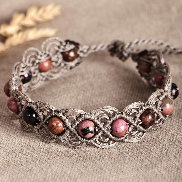 a close up of a bracelet on a table