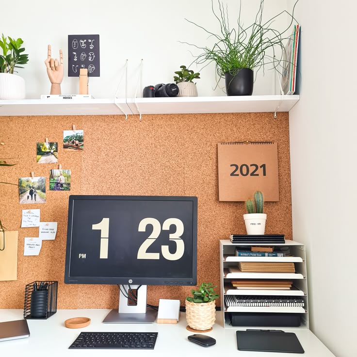 a desk with a desktop computer and office supplies