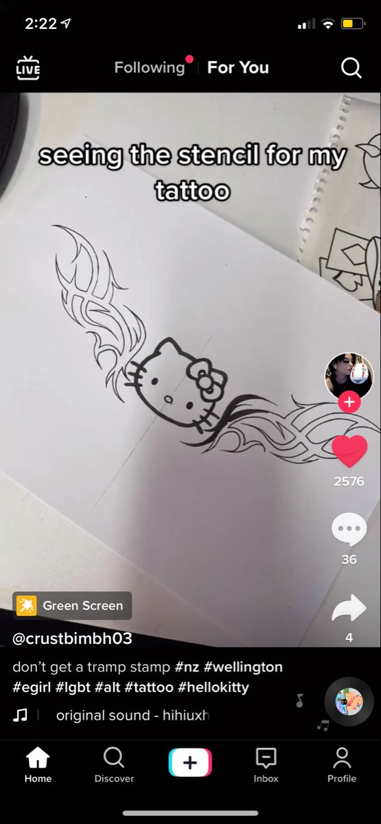 someone has drawn a hello kitty tattoo on their phone