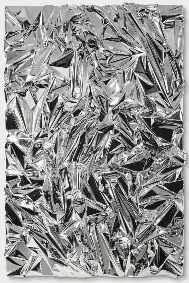 a black and white photo of silver foil