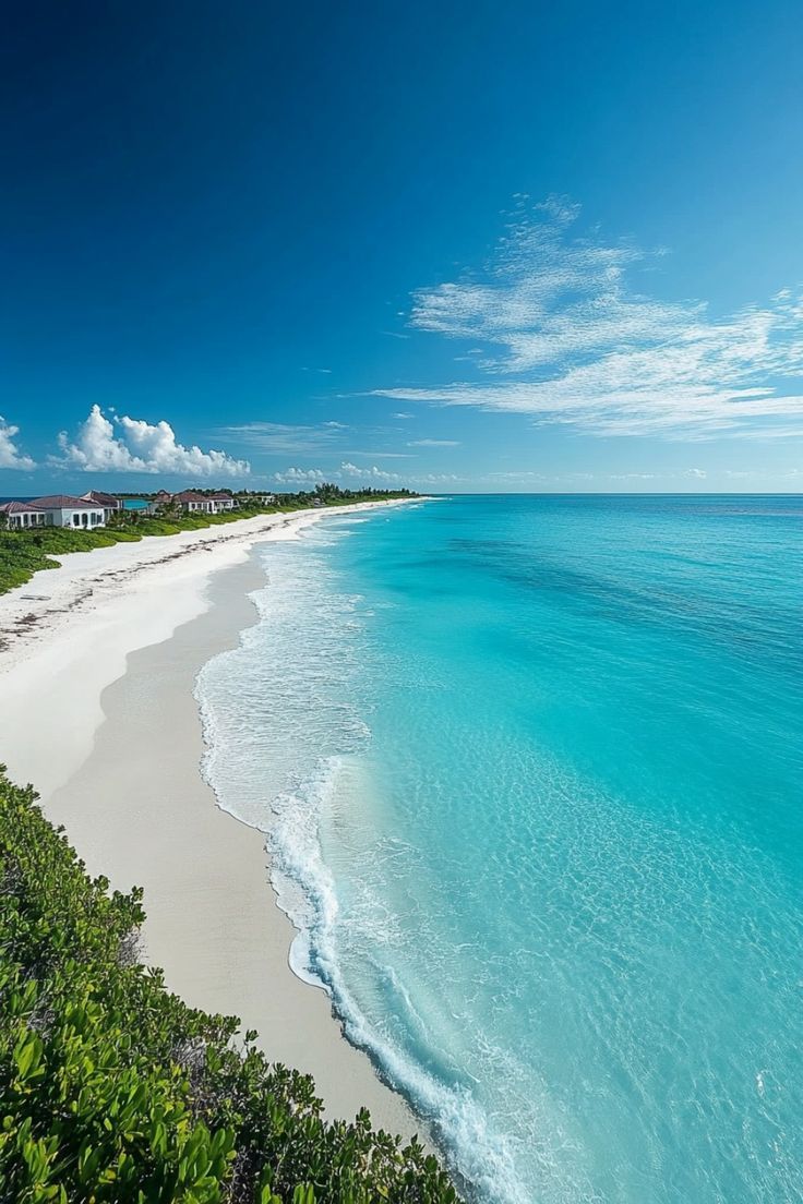 the beach is clear and blue with white sand