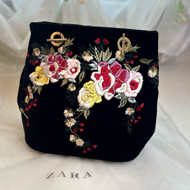 New With Tag Black Velvet Bag With Embroidered Flowers And Gold, Chain Shoulder Strap And Magnetic Closure. Strap Can Be Removed And Converted To A Cross Body 9 1/2" High By 5 1/2" Wide Chain Length 19" B2 Evening Bags With Embroidered Logo, Chic Evening Bags With Floral Embroidery, Chic Evening Bag With Floral Embroidery, Elegant Shoulder Bag With Multicolor Embroidery, Formal Black Embroidered Bag, Chic Floral Embroidered Evening Bag, Black Embroidered Bag For Daily Use, Chic Black Embroidered Shoulder Bag, Embroidered Black Shoulder Bag With Double Handle