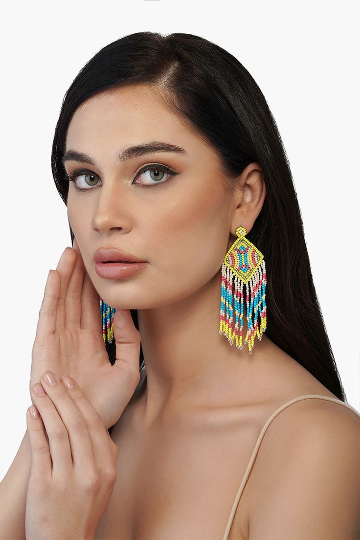 Every winter and Spring'22 runway has focused on this particular trend- The drop earrings! One of the most universally flattering ways to accessorize, we are loving the Neon Lights Earrings this season. Hand beaded with vibrant shades of green, turquoise and coral. They will make every outfit come alive dancing to your every move. Hand crafted by skilled artisans from India, they feature bead fringes detail. Style it with happy dresses and easy outfits alike to go from day to night. Beautiful Ni Vibrant Beaded Summer Jewelry, Vibrant Turquoise Jewelry For Summer, Trendy Multicolor Festive Jewelry, Festive Multicolor Trendy Jewelry, Trendy Summer Chandelier Drop Earrings, Colorful Beads Jewelry For Summer Festivals, Trendy Beaded Earrings With Dangling Beads For Summer, Trendy Dangling Beads Jewelry, Trendy Dangling Beaded Earrings For Summer