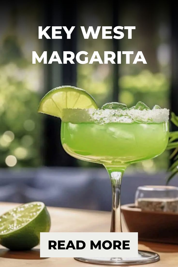 a green margarita sitting on top of a wooden table