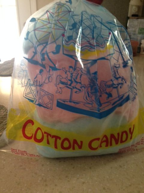 a plastic bag filled with cotton candy sitting on top of a counter