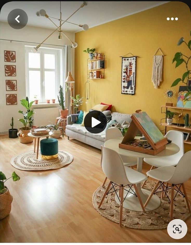 a living room filled with furniture and yellow walls