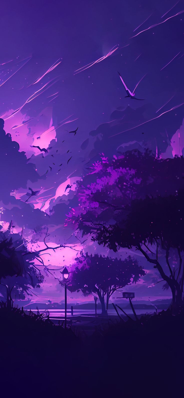 a purple sky with birds flying in the distance