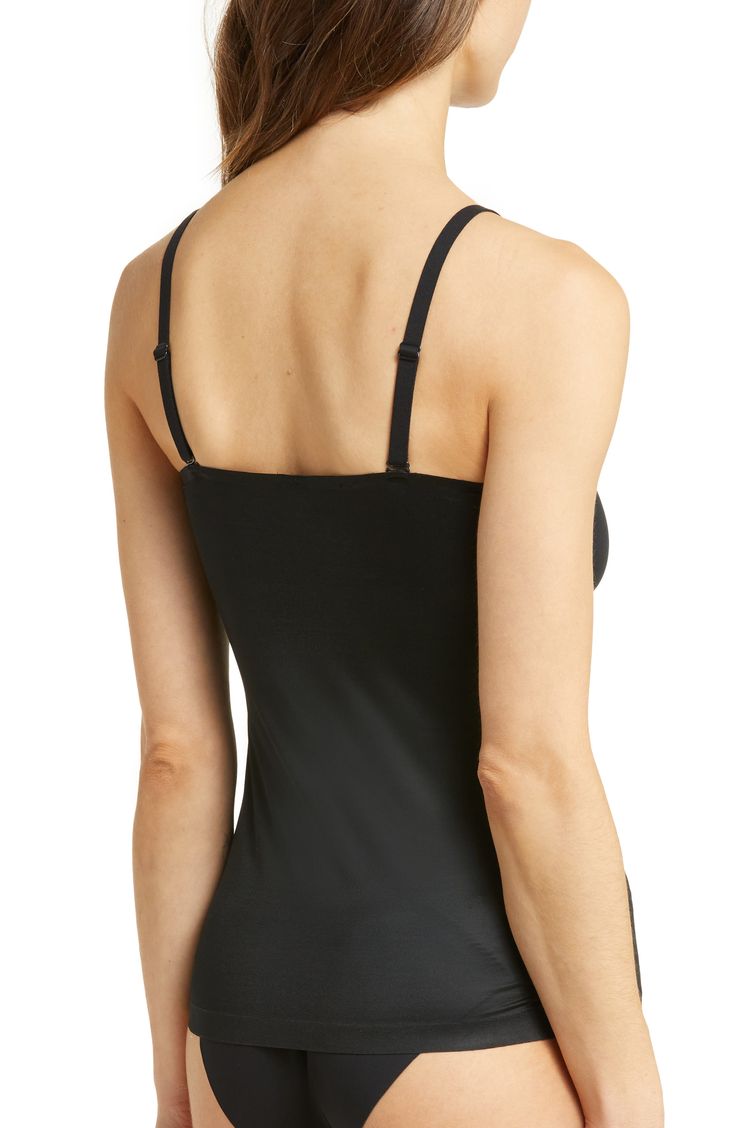 Create a smooth look under everyday outfits with this lightweight, breathable shaping cami that wraps around your body and targets your tummy and sides. The stretchy, single-layer fabric smoothes out any lumps or bumps, and the noncompression bust offers a squish-free fit. 15 1/2" center front length (size Medium) Scoop neck Adjustable straps 77% nylon, 23% elastane body; 55% nylon, 45% Lycra® elastane bust Machine wash, tumble dry Imported Workout Top With Built-in Bra And Second-skin Fit, Nylon Cami Top With Built-in Bra, Elastane Camisole With Built-in Bra, Nylon Camisole With Built-in Bra, Medium Support Camisole Tank Top With Built-in Bra, Workout Shapewear Tank Top With Built-in Bra, Shapewear Tank Top With Built-in Bra, Second-skin Tank Top With Built-in Bra For Workout, Sleek Black Seamless Tank Top