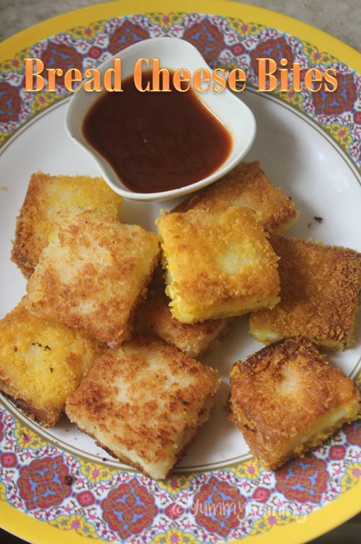 bread cheese bites on a plate with ketchup