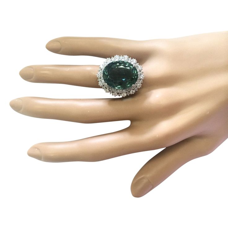 Stamped: 14K White Gold Total Ring Weight: 11.3 Grams Ring Length: N/ARing Width: N/A Gemstone Weight: Total Natural Tourmaline Weight is 17.90 Carat (Measures: 18.30x14.55 mm) Color: Green Diamond Weight: Total Natural Diamond Weight is 2.00 Carat Quantity: 62 Color: F-G, Clarity: VS2-SI1 Face Measures: 26.10x22.50 mm Sku: [703621W] Luxury Tourmaline Gemstones With Accent Stones, Luxury Emerald Ring With Accent Stones For Formal Occasions, Luxury Tourmaline Emerald Ring, Formal Emerald Gemstones With Accents, Formal Multi-stone Emerald Gemstones, Luxury Green Topaz Gemstone Ring, Elegant Tourmaline Diamond Ring With Accent Stones, Luxury Oval Tourmaline Emerald Ring, Elegant Tourmaline Gemstone Diamond Ring