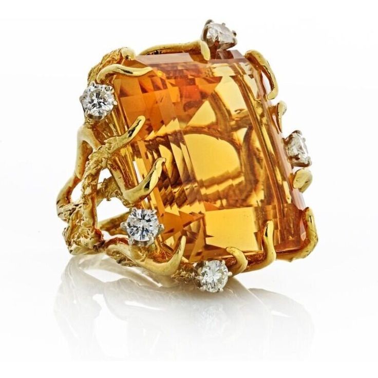 Transport yourself back to the glamorous era of the 1970s with our exquisite 18K Yellow Gold Citrine and Diamond Ring. This stunning piece captures the essence of the time, exuding elegance and sophistication.At the heart of this ring is a breathtaking 117-carat citrine, radiating warmth and capturing the golden hues of the sun. The vibrant gemstone is beautifully complemented by approximately 2 carats of dazzling diamonds, which dance and sparkle with every movement. The diamonds frame the citr Yellow Gold Setting, Tennis Necklace, Diamond Design, The 1970s, Brilliant Diamond, Gold Set, Eternity Bands, Estate Jewelry, The Golden