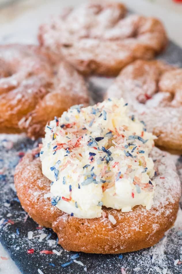 several pastries with sprinkles and powdered sugar