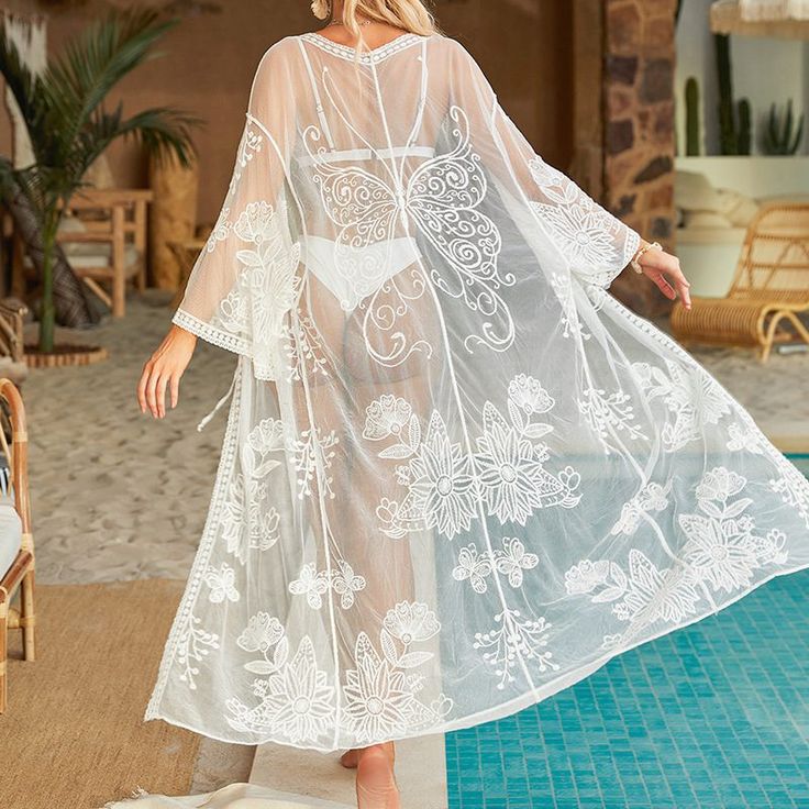 F00163584-100 White Sheer Beachwear Cover-up, White Sheer Cover-up For Spring, White Cover-up For Brunch During Beach Season, Maxi Length Beachwear Cover-up For Brunch, White Flowy Cover-up For Vacation, Flowy White Breezy Cover-up, Bohemian Spring Brunch Cover-up, White Breezy Cover-up For Vacation, Sheer Long Vacation Dress