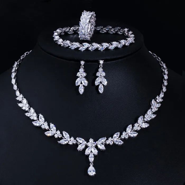 Complete your wedding look with this elegant Bridal Necklace and Earring Jewelry Set. The set is designed to add a touch of sophistication and style to your bridal ensemble, making you shine on your special day.
– This bridal a plus cubic zirconia gemstone necklace set is perfect for adding elegance to any bridal ensemble.– Made with high-quality materials, this set includes a stunning necklace and matching earrings for a complete look.– Perfect for pageant, bridal, bridesmaid, prom, quinceañer Ring And Bracelet, Wedding Necklace Set, Zircon Necklace, Bridal Necklace Set, Bracelet Wedding, Fashion Jewelry Sets, Wedding Bridal Jewellery, Leaf Jewelry, Wedding Jewelry Sets