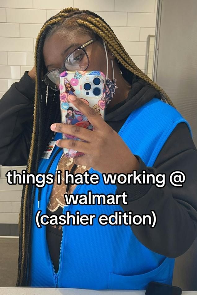 a woman taking a selfie in the bathroom with her cell phone up to her face