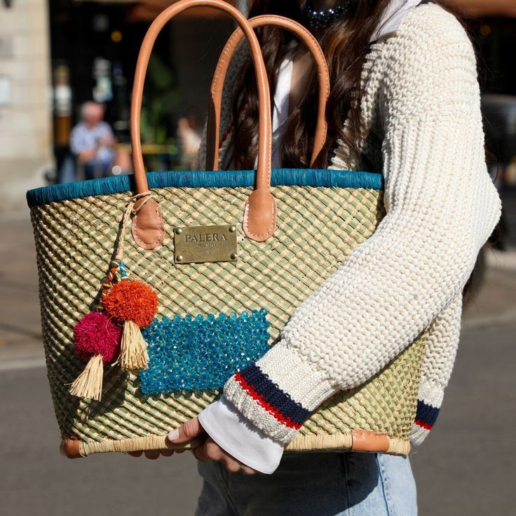 Introducing the “Palera Cocktail" Bag —a stunning testament to sustainability and artisanal craftsmanship. The Raffia Part is handcrafted by skilled artisans in Madagascar. Then it is finalized and embellished with Palera Milano Signature crystals in Italy, adding a touch of shine, elegance, and uniqueness to each piece.Each piece is made entirely from scratch, ensuring a distinctive identity with every creation. Knots and irregularities are celebrated as symbols of authenticity. Material: Raffi Crystal Bags, Classic Bags, Sparkling Crystal, Metal Hardware, Blue Bags, From Scratch, Timeless Elegance, 20 Cm, Sustainability