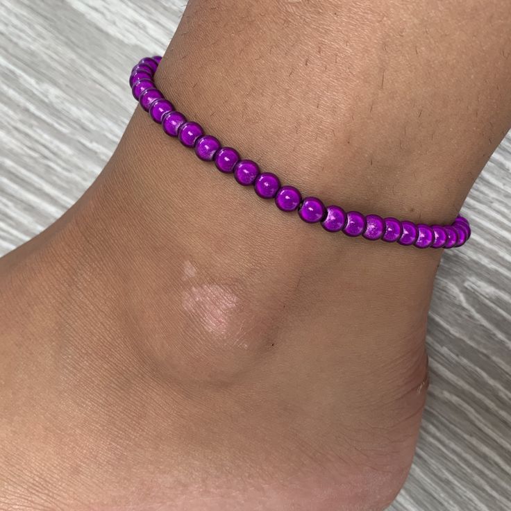 🌸 Dark purple miracle bead anklet 🌸  ♥️Catches the light to give off a glow!  ♥️Perfect for nights out or even holidays!  ♥️Please message me if you have any questions each  ♥️ All anklets are made on rope. The two ends will need to be tied together and in a double knot so that the anklet does not come off. These are safe to wear in water.  Also available with matching bracelets, earrings and chokers! The colour may vary slightly due to most images being taken under direct sunlight or with flash to show you the full effect of the beads x  White beads may appear grey/silver when opened in a dark room. The full effect of the beads will shine through in different lights. Please note: Buyer pays for any return postage/ exchange postage x Bead Anklet, Double Knot, Beaded Anklets, Dark Room, Anklet Jewelry, Matching Bracelets, White Beads, Dark Purple, Infinity Bracelet