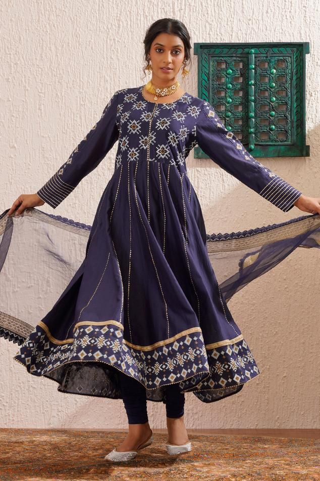 Navy blue long sleeves anarkali featuring floral block print yoke and gold detailing. Paired with churidar and organza dupatta with lace accents., Fit: Relaxed Long Sleeves Anarkali, Block Print Anarkali, Floral Block Print, Organza Dupatta, Women Kurta, Female Clothing, Churidar, Set For Women, Aza Fashion