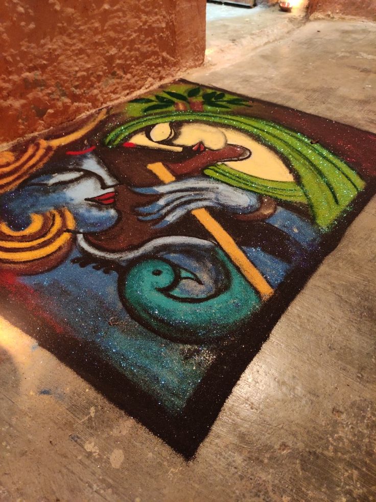 a painting on the ground in front of a building