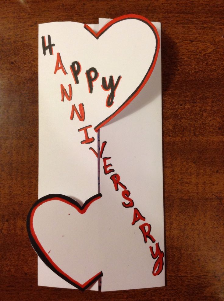 a happy new year card with two hearts and the words happy new year on it